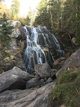 The first waterfall fanning over polished granite slabs in Bells Canyon